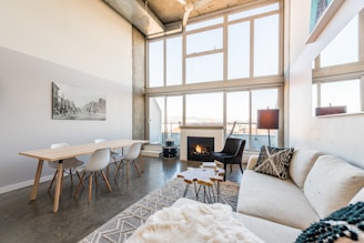 a living room filled with furniture and a fire place