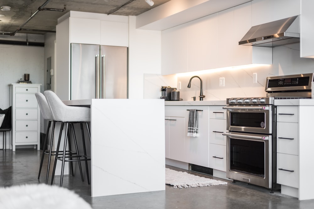 a kitchen with a stove top oven and a counter top oven