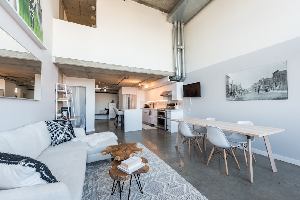 a living room filled with furniture and a flat screen tv