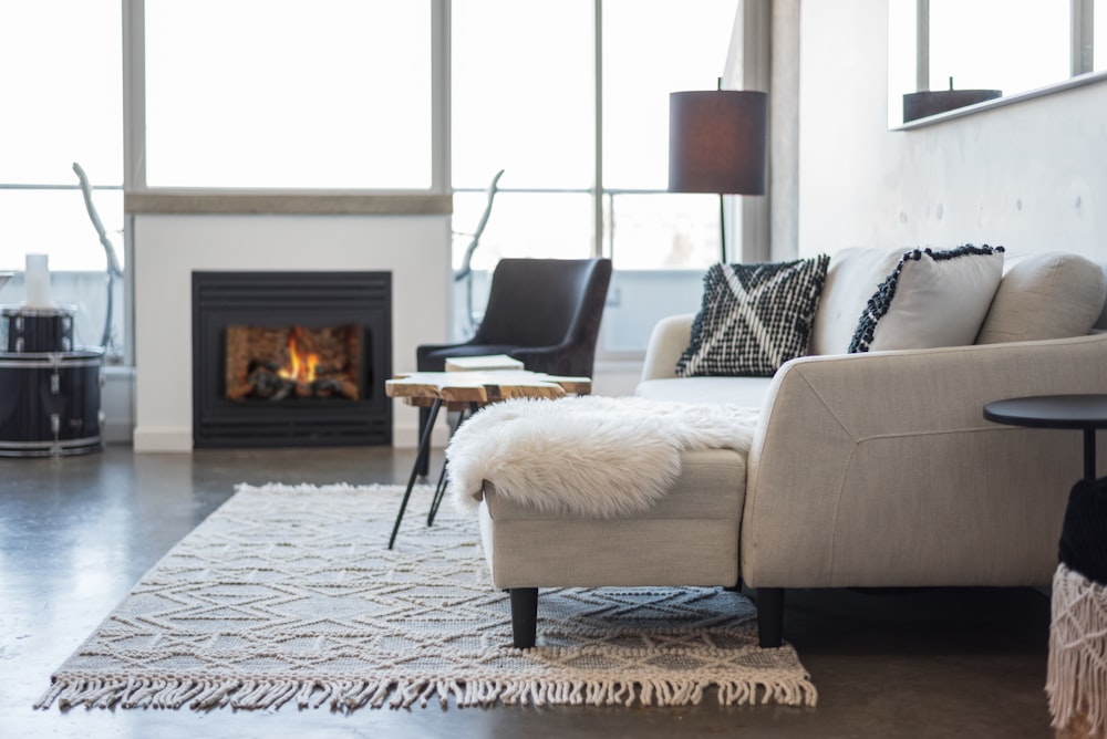 a living room filled with furniture and a fire place