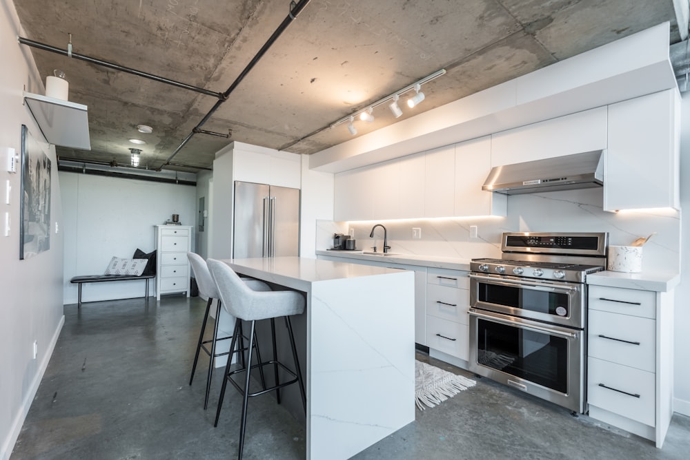 a kitchen with a stove top oven next to a counter