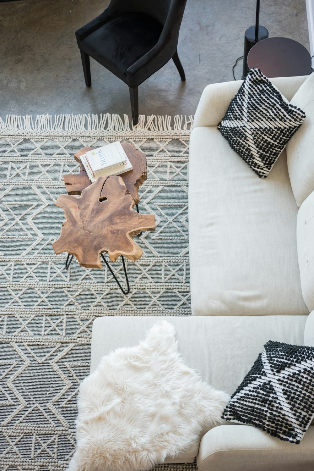 a living room with a white couch and a coffee table