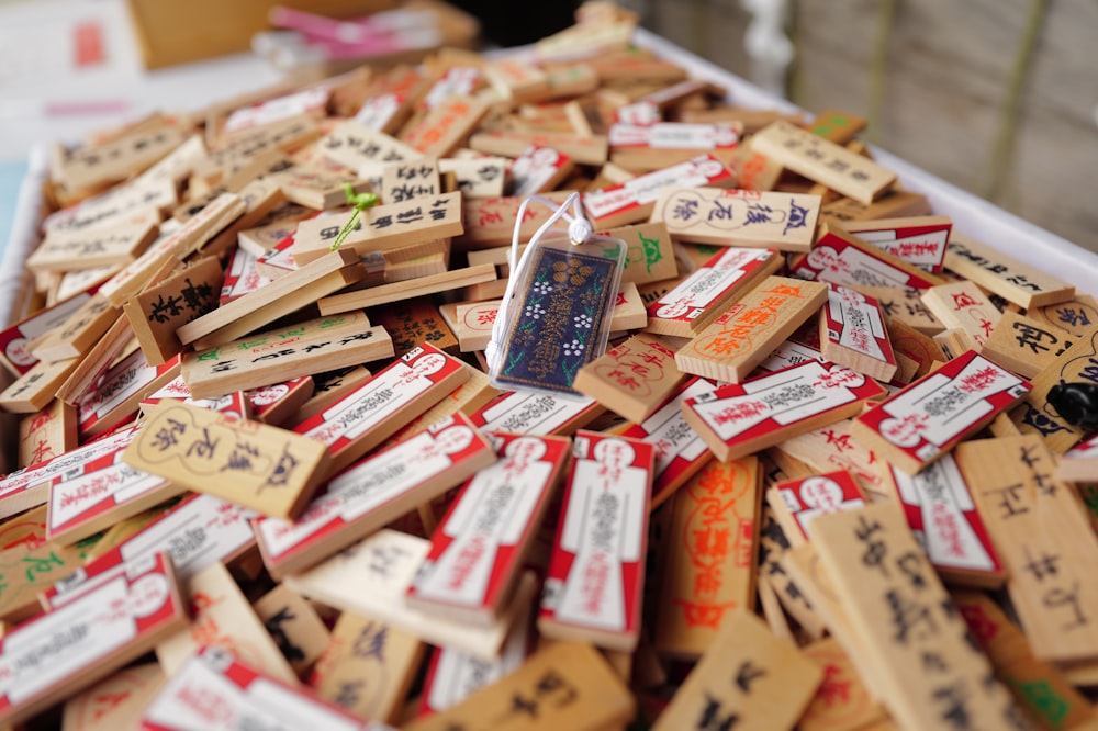 a pile of wooden stamps with chinese writing on them