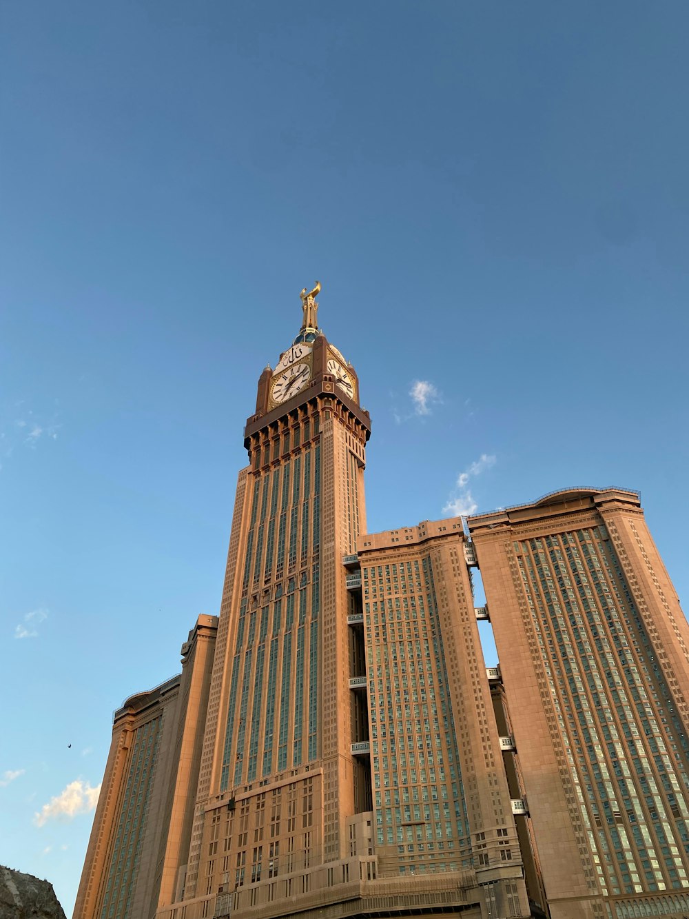 a tall building with a clock on the top of it