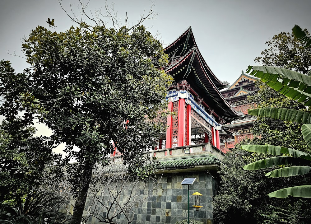 a building with a red and white tower on top of it