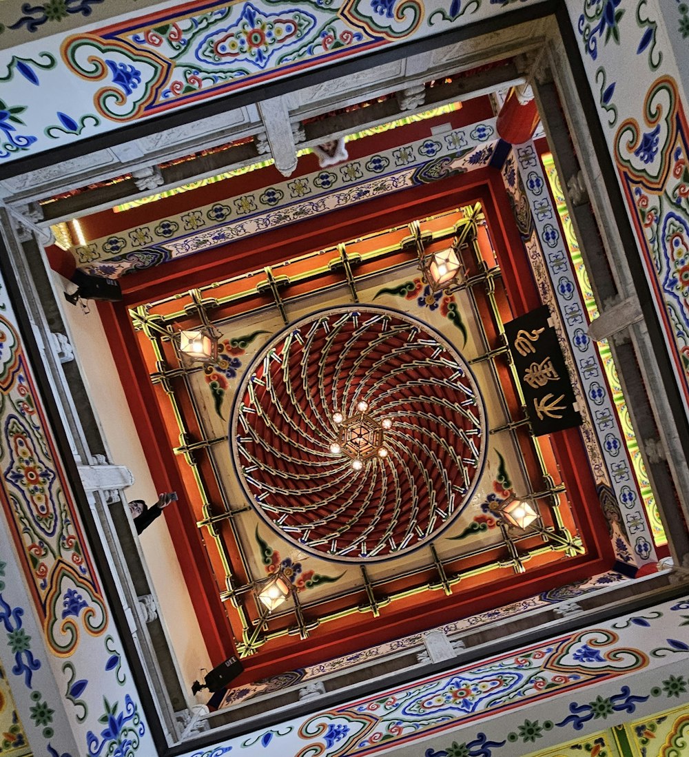 the ceiling of a building with a circular design