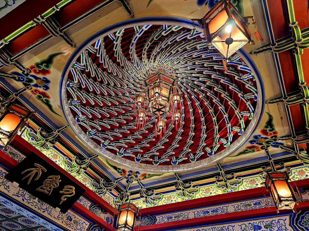 a fancy chandelier hanging from the ceiling of a restaurant