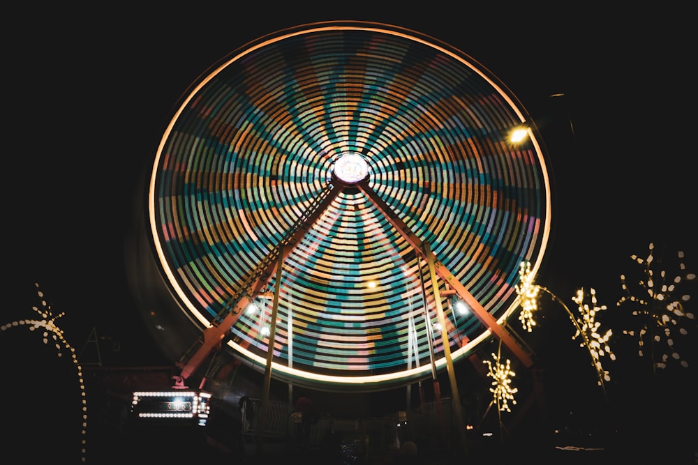 a large ferris wheel lit up at night