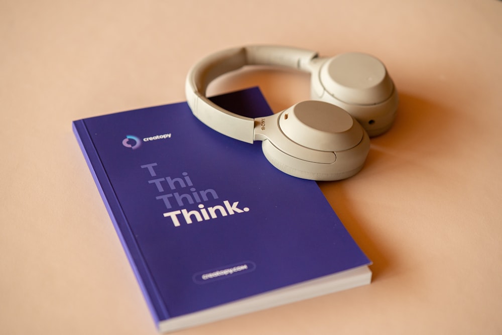 a book with a pair of headphones on top of it