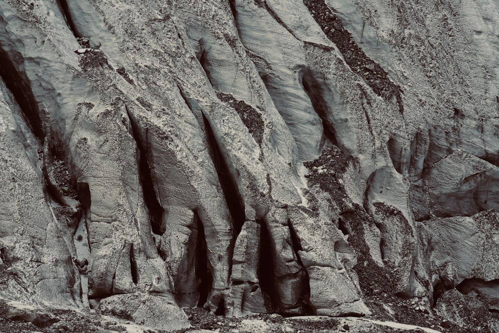 a black and white photo of a rock formation