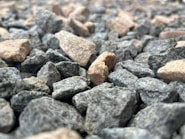 a bunch of rocks that are on the ground