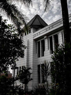 a white building with a clock on the front of it