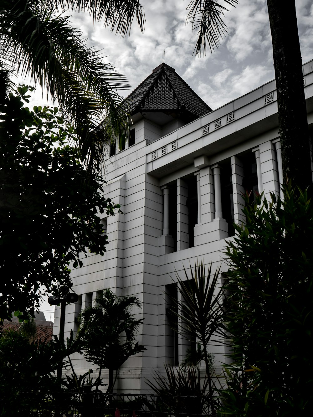 a white building with a clock on the front of it