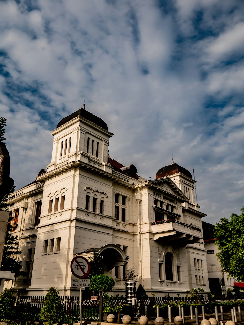 a large white building with a clock on the front of it