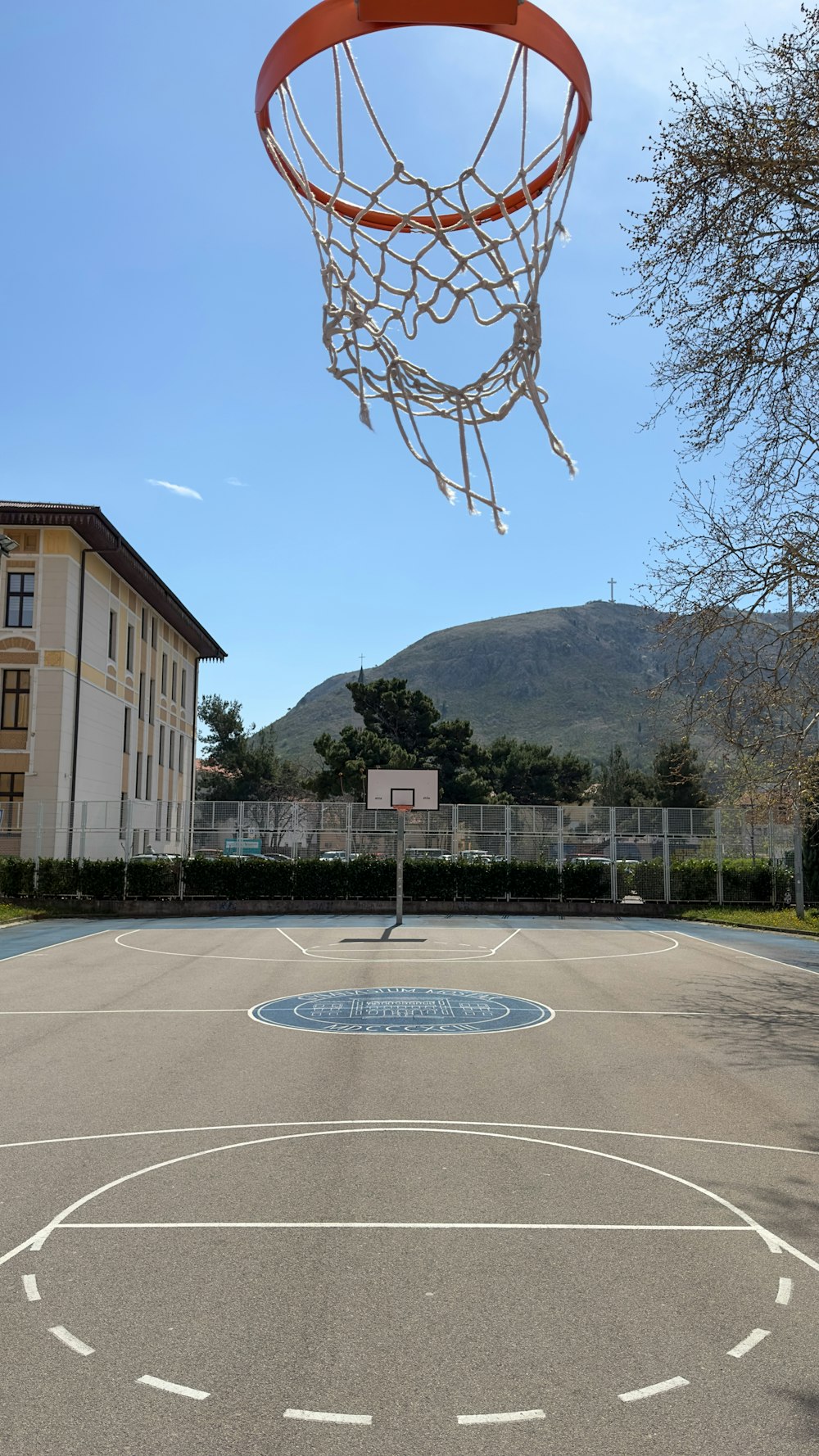 a basketball court with a basketball hoop in the air