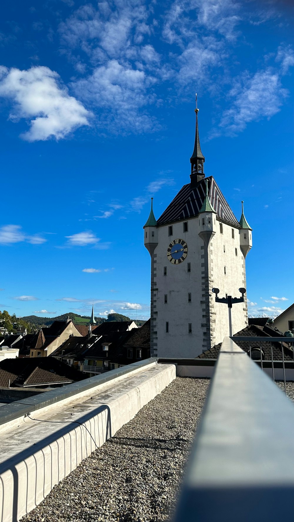 a white tower with a clock on the top of it