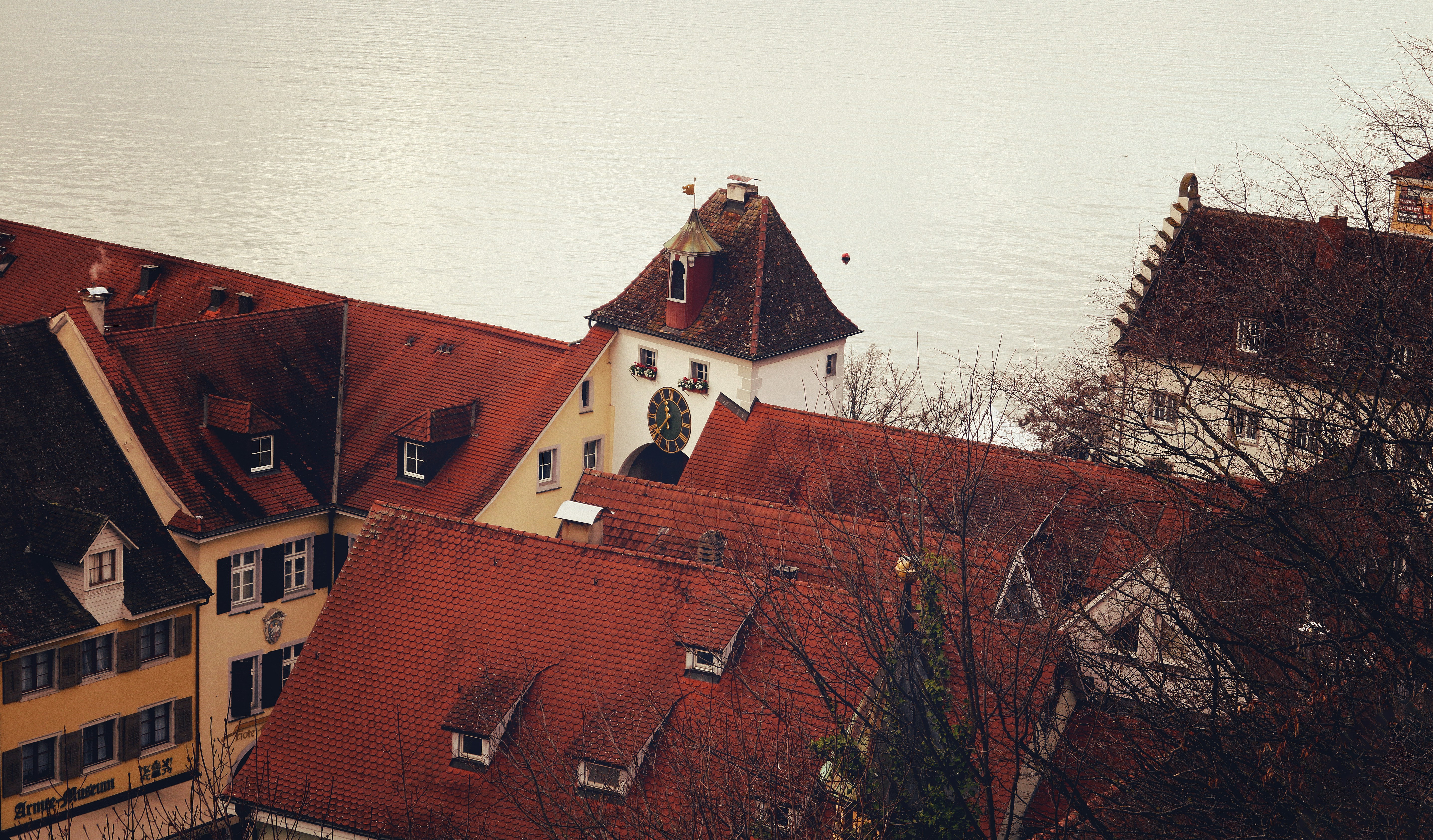 a view of some buildings and a body of water