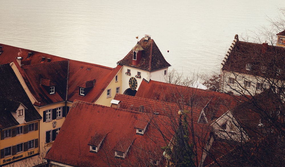 a view of some buildings and a body of water