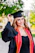 a woman in a graduation cap and gown