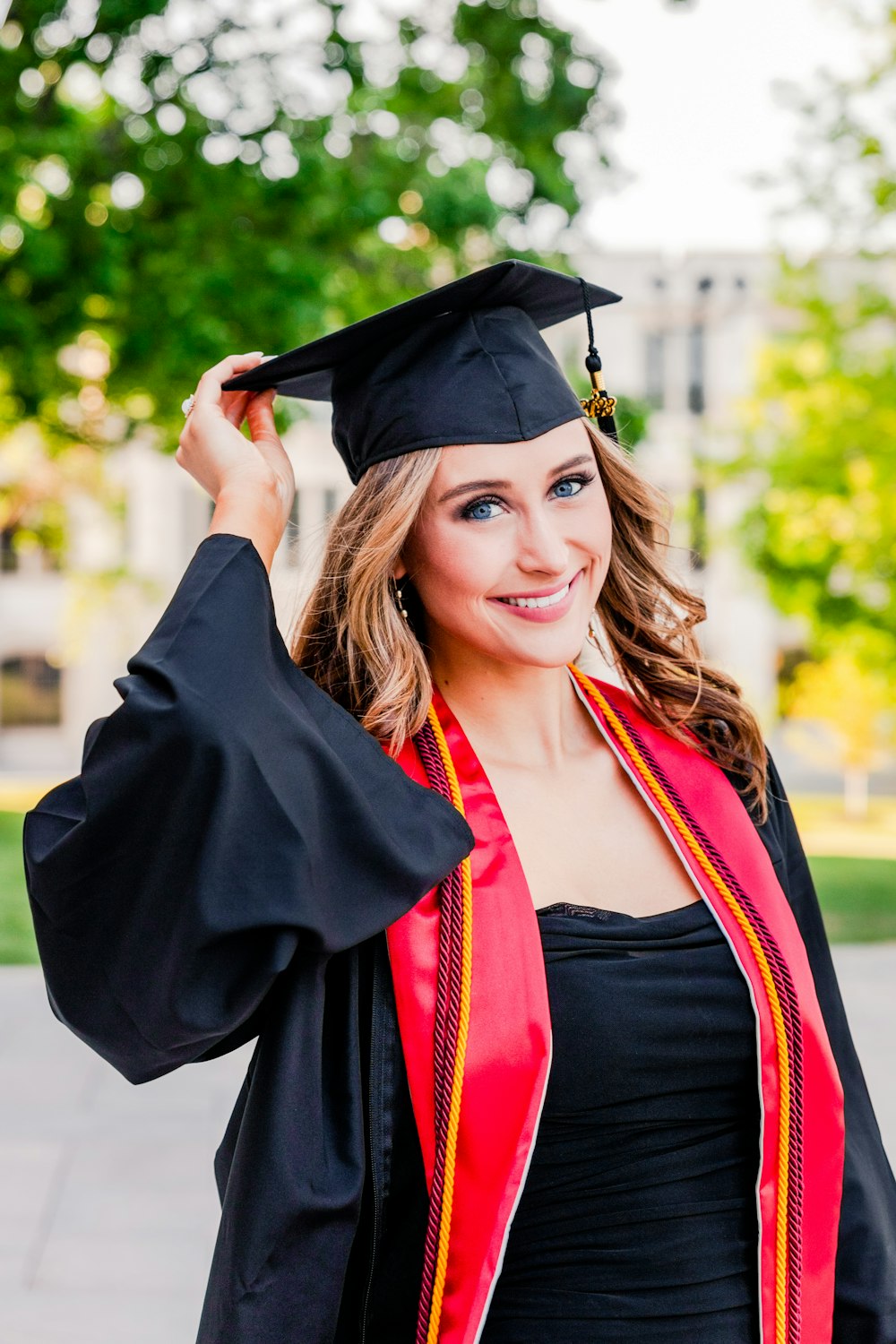 a woman in a graduation cap and gown