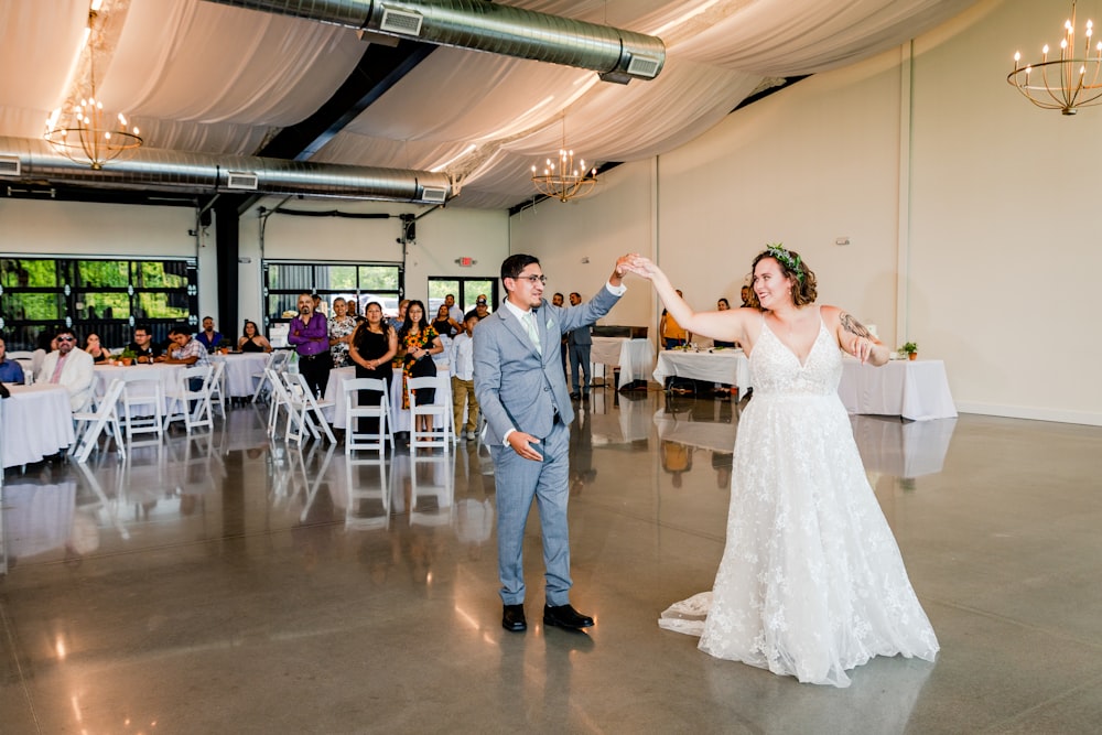 a bride and groom dancing at their wedding reception