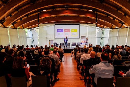 a man giving a presentation to a group of people