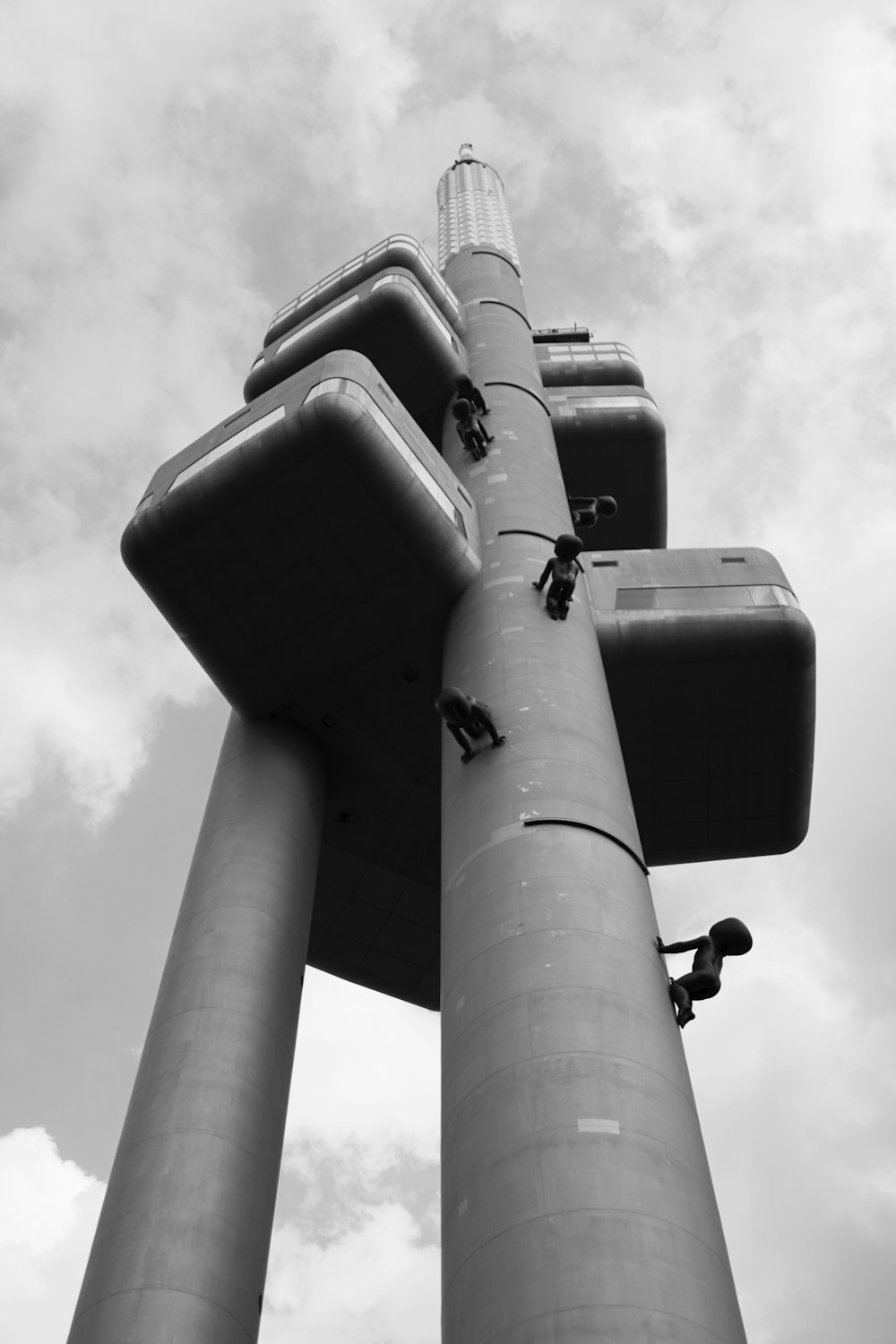 a black and white photo of a tall pole