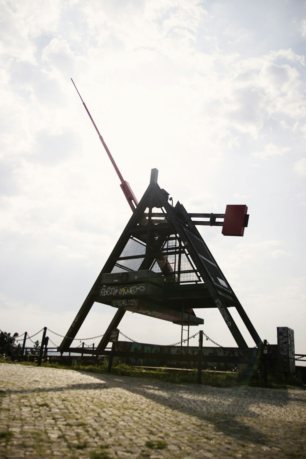 a man is standing on top of a tower