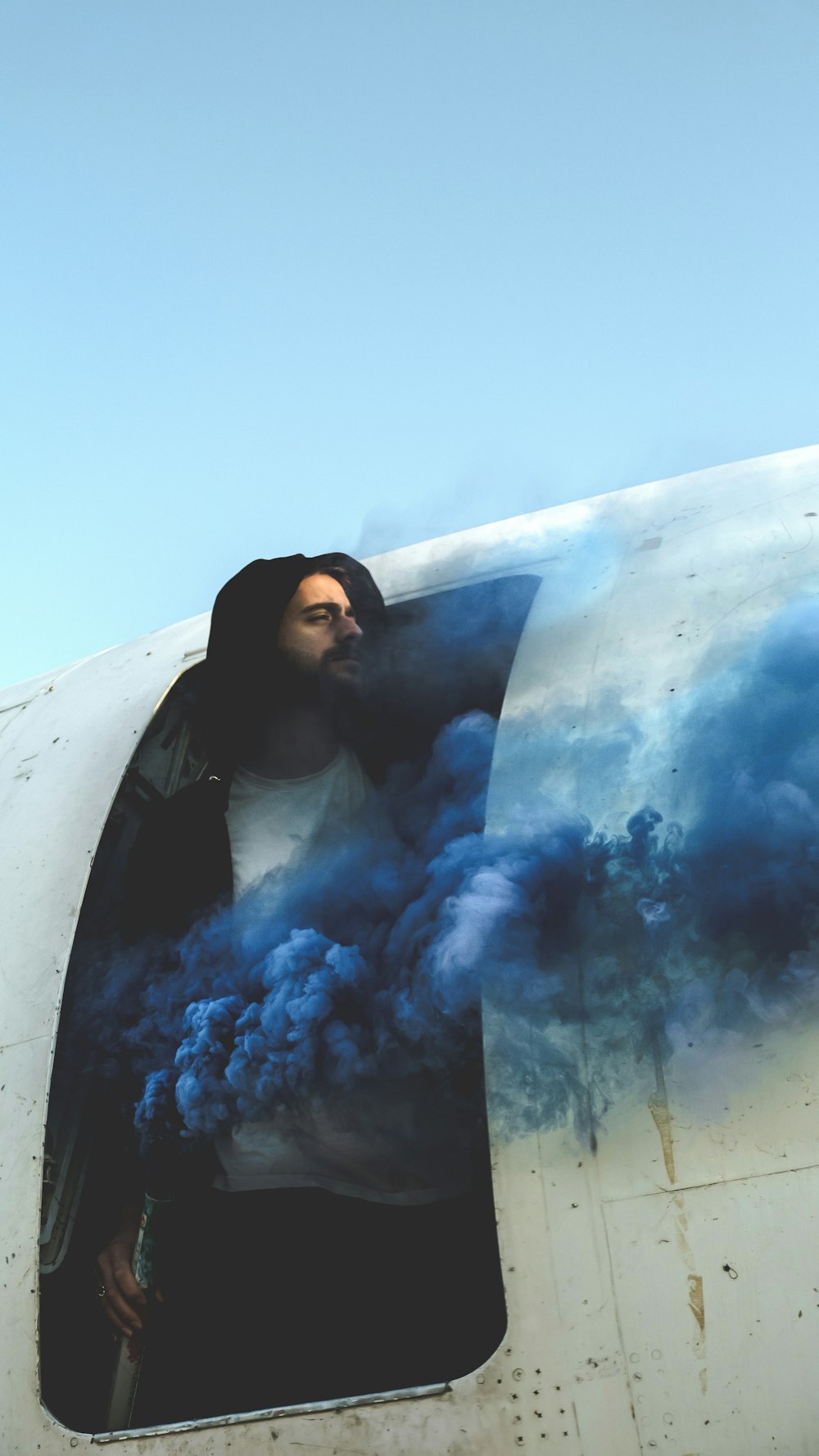 a man standing in the window of an airplane