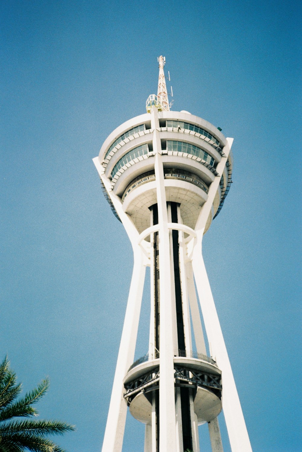 a tall white tower with a sky background