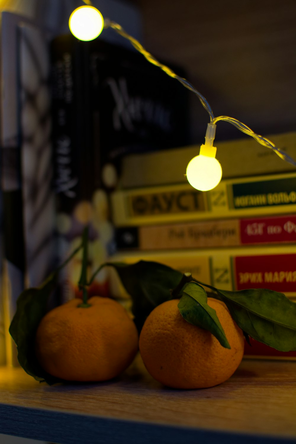 a couple of oranges sitting on top of a table