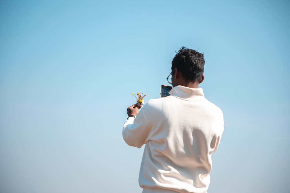 a man flying a kite in the sky