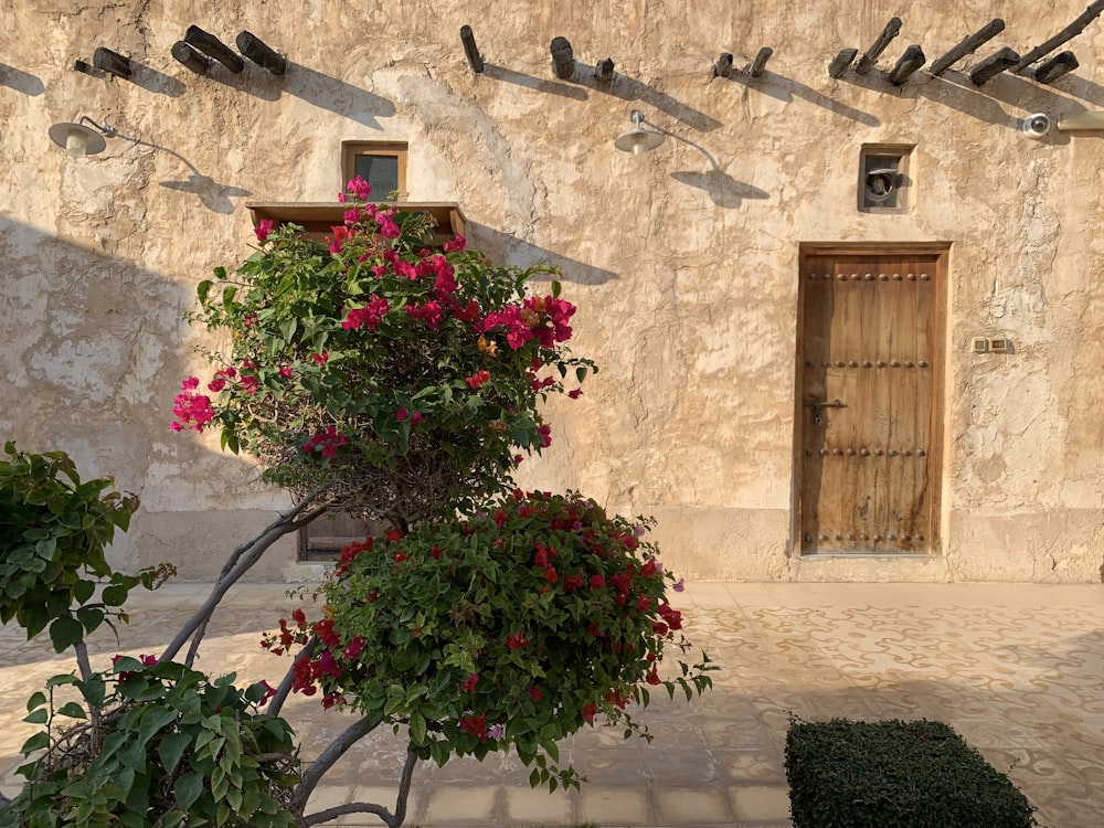 a building with a bunch of flowers in front of it