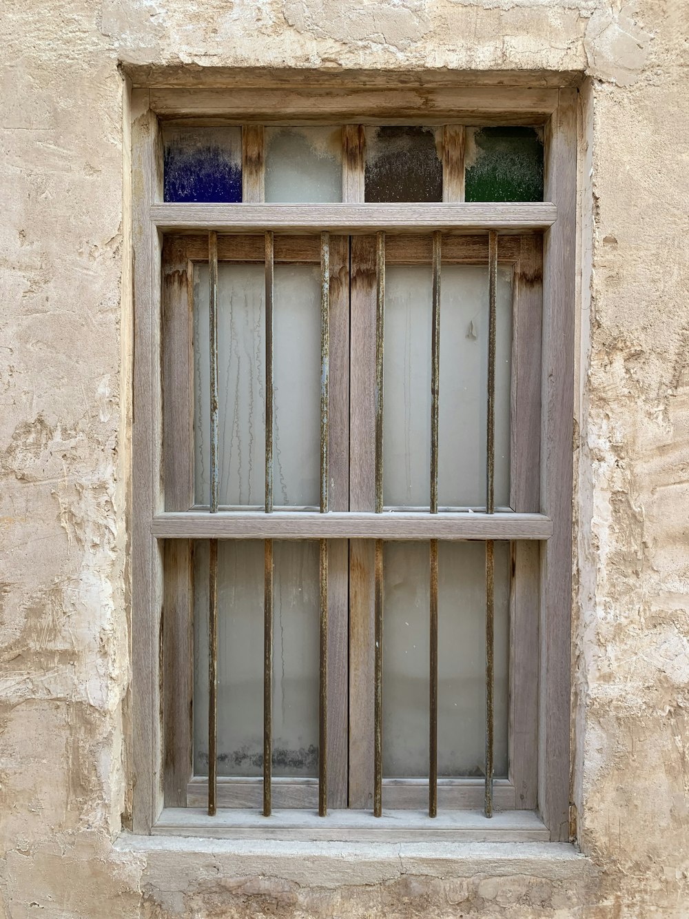 a window with bars on the outside of it