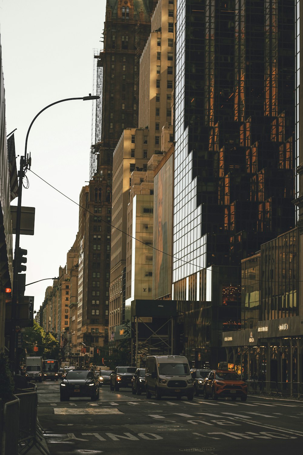 a city street filled with lots of tall buildings