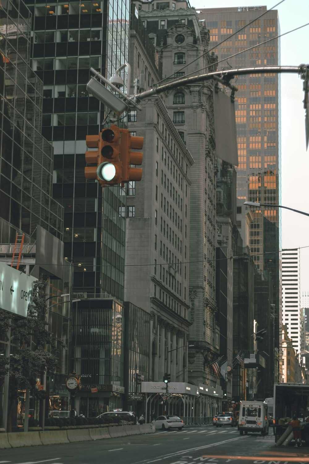 a traffic light hanging over a city street