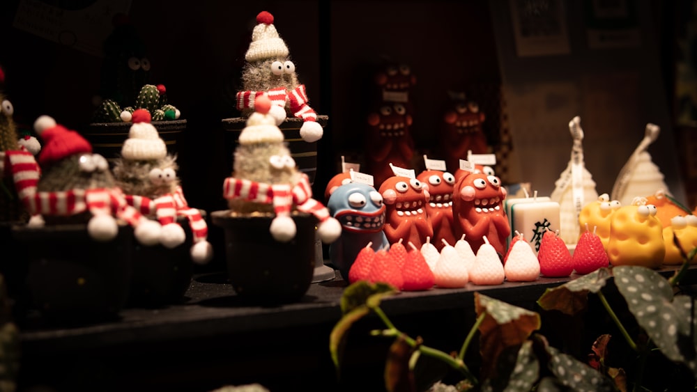 a table topped with lots of fake christmas decorations