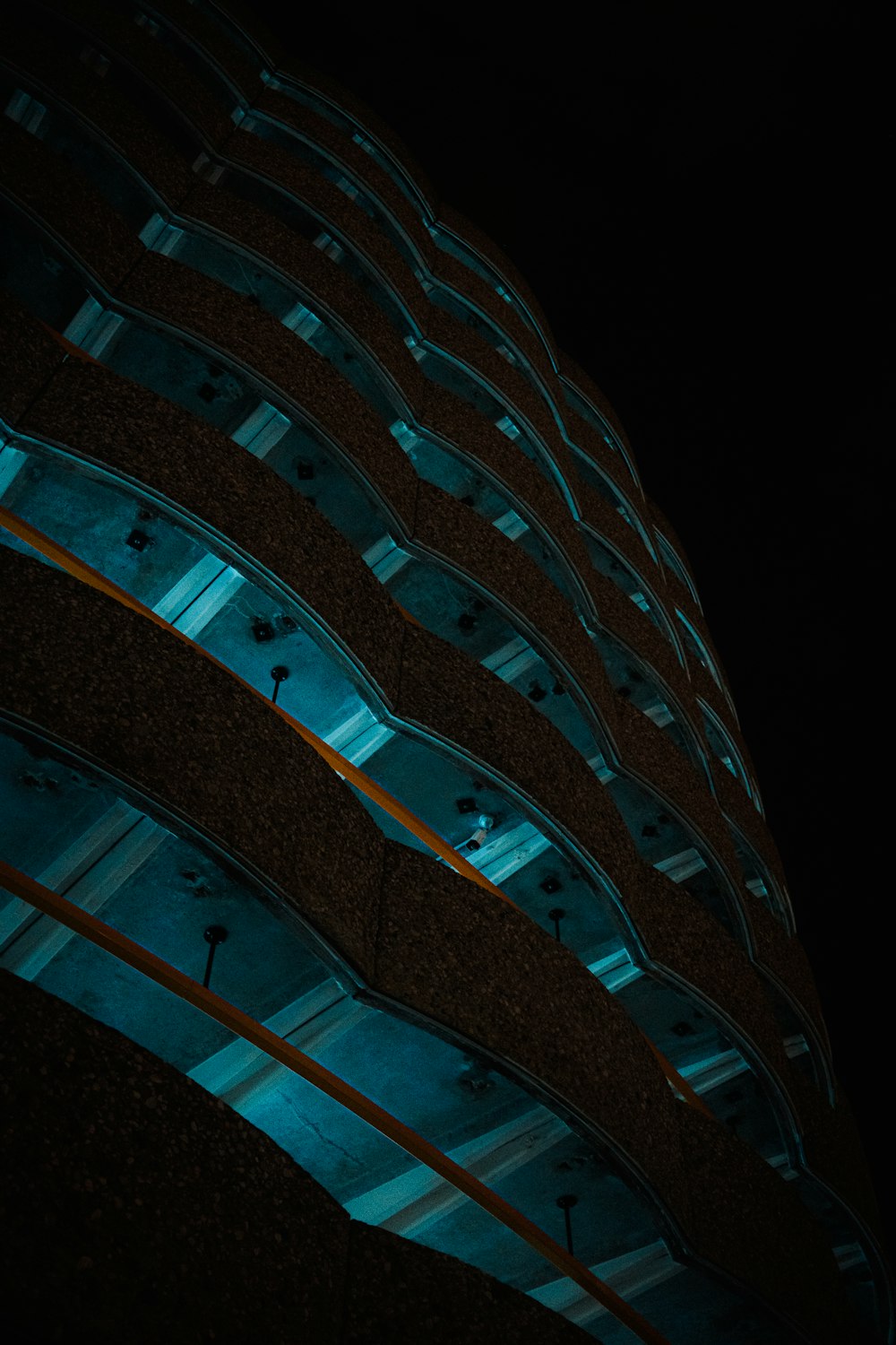 a tall building lit up with blue lights