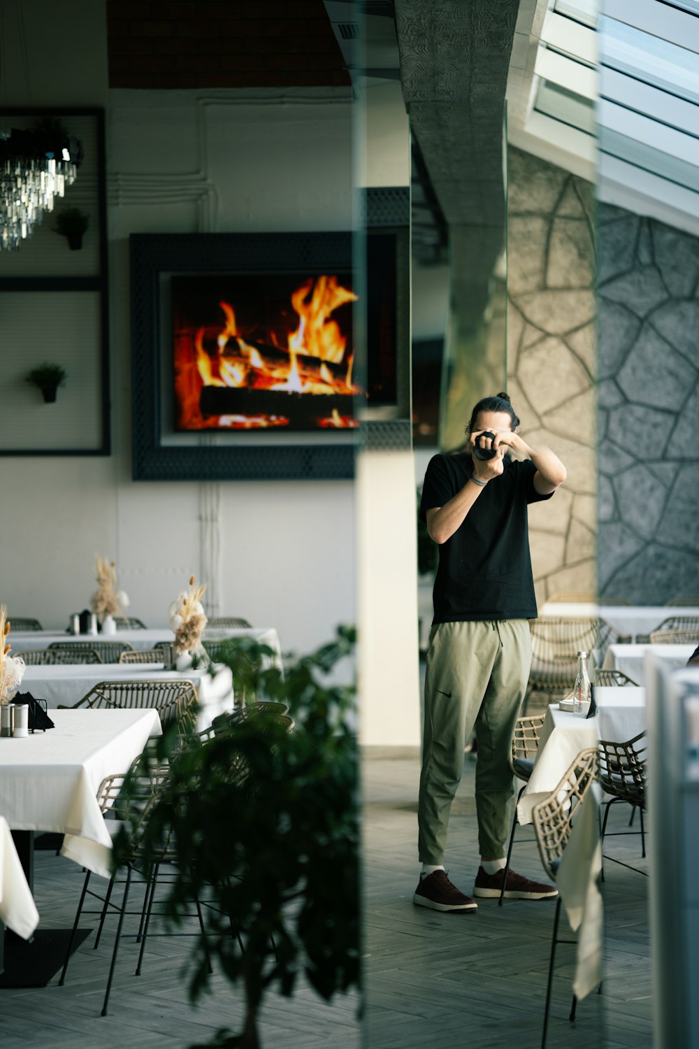 a man taking a picture of himself in a restaurant