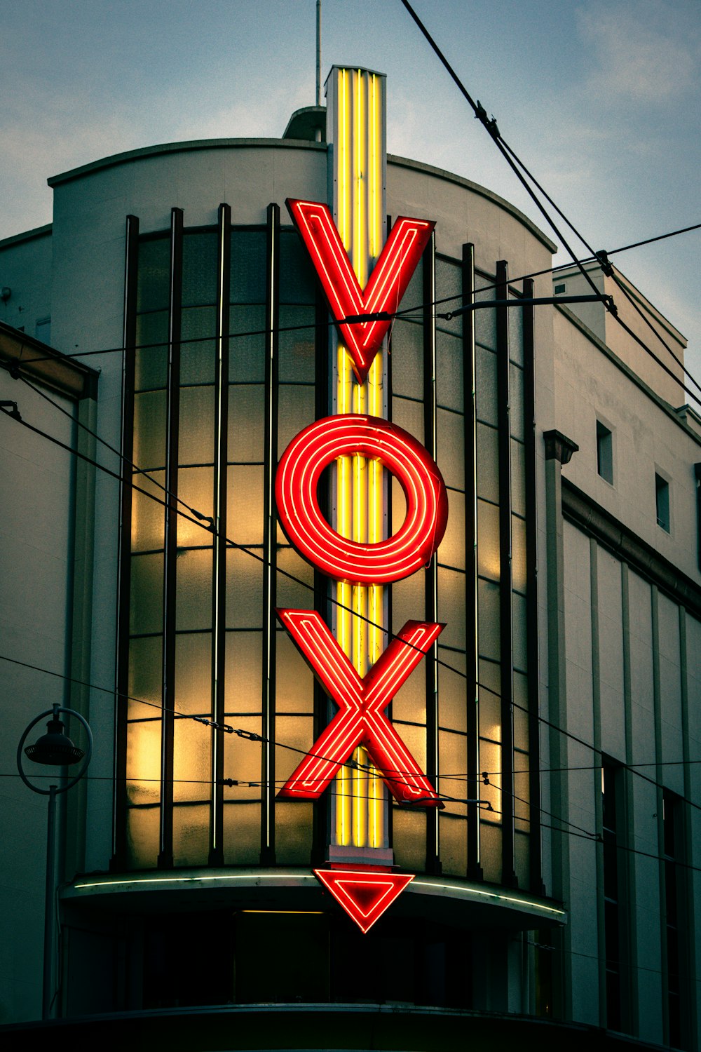 a large neon sign on the side of a building