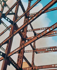 a close up of a metal structure with a sky background
