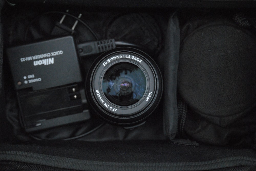a camera sitting inside of a black bag