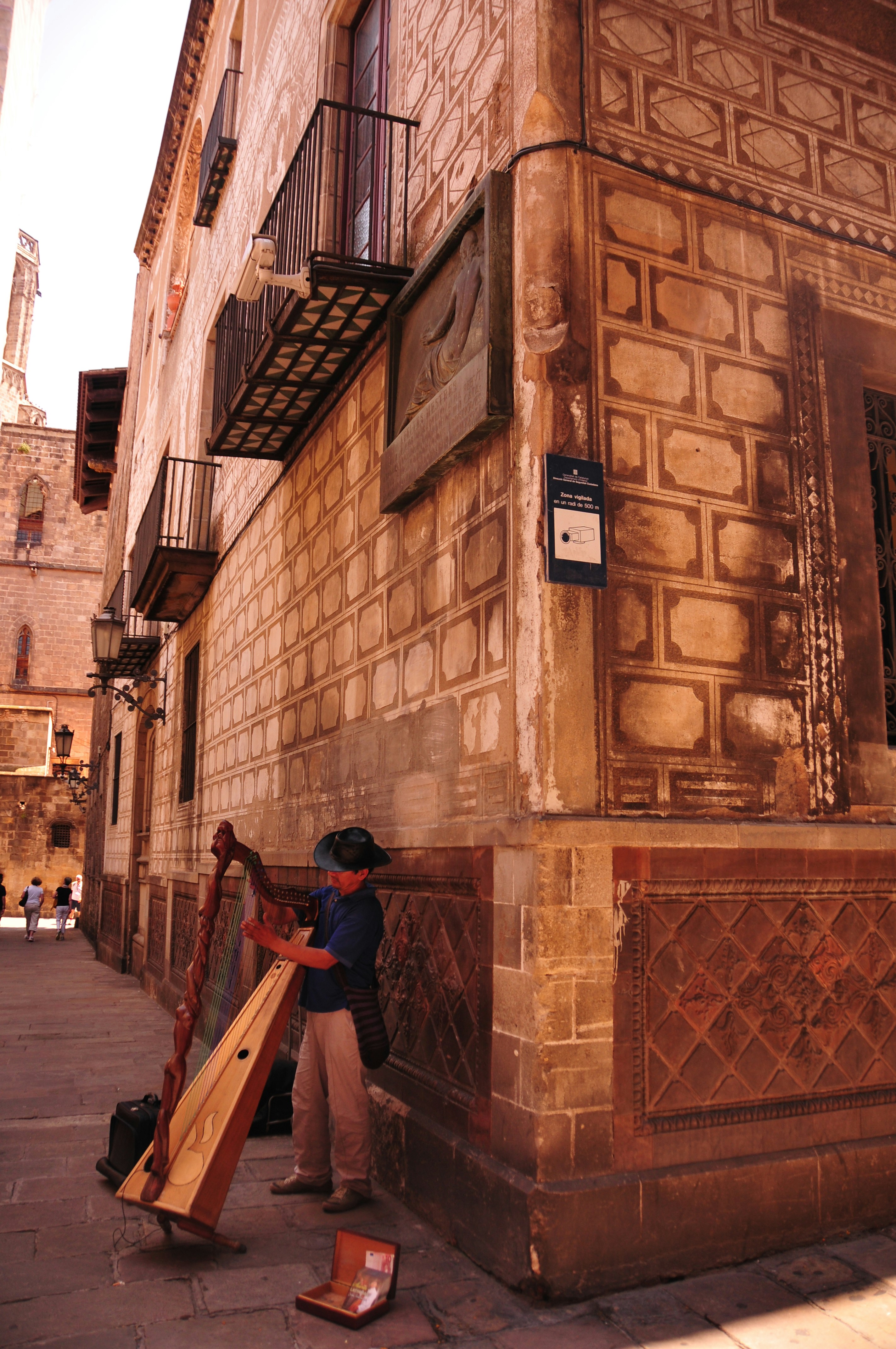 a man standing next to a tall building