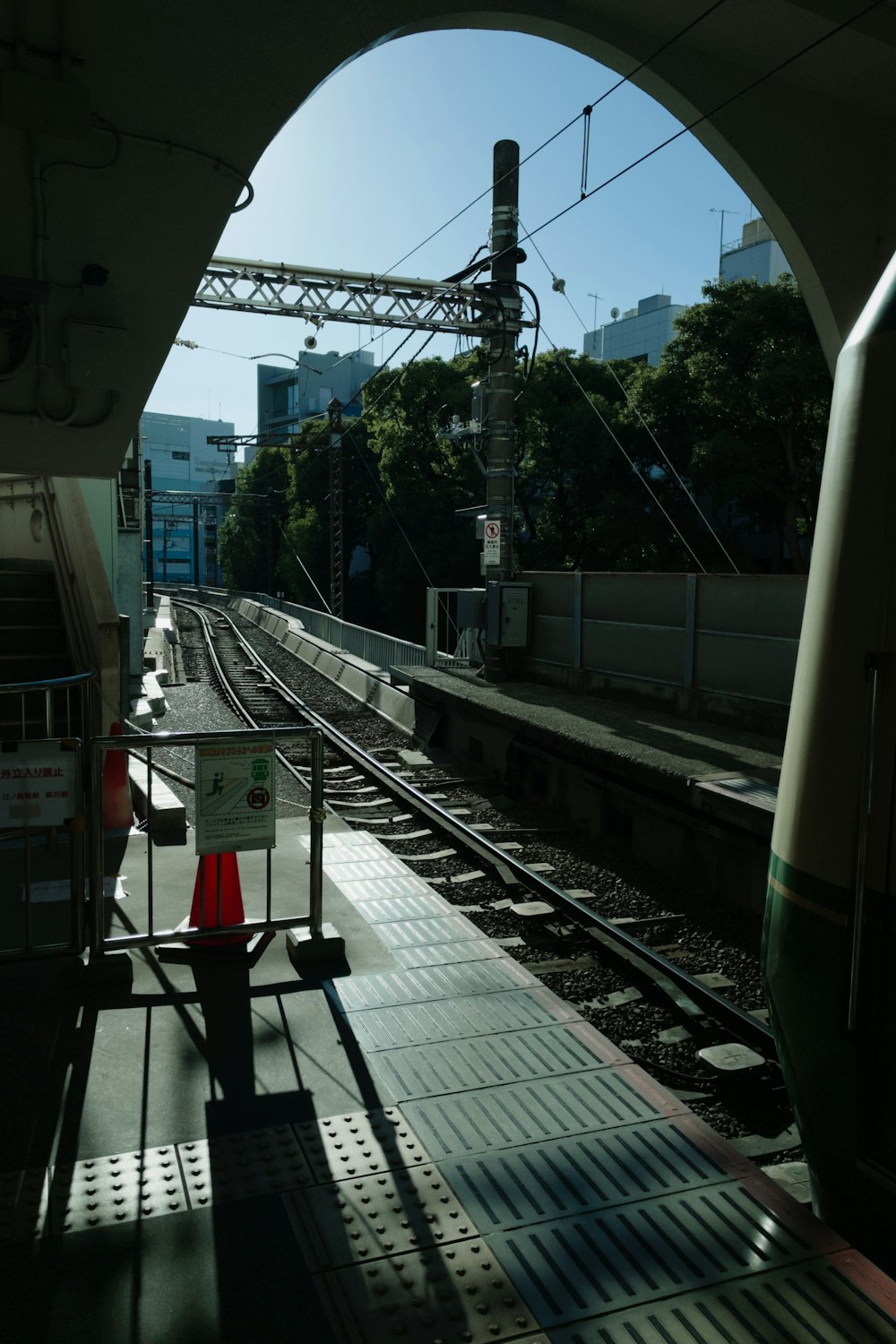 a train station with a train on the tracks