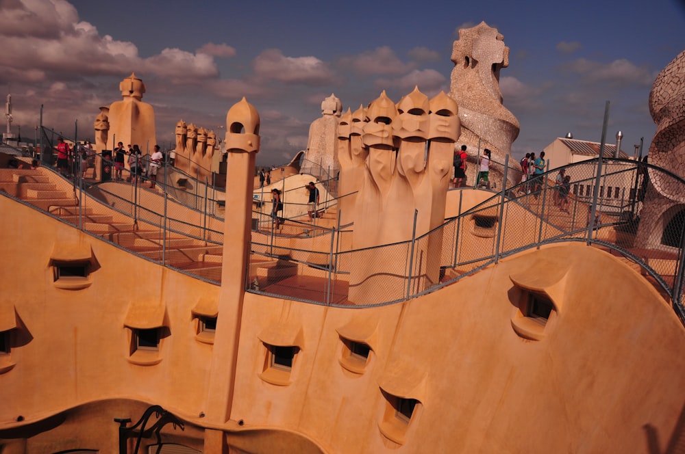 a group of people standing on top of a wooden structure