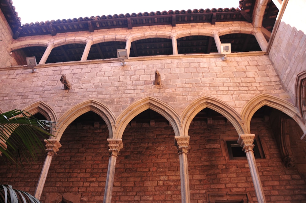 a large brick building with arches and arches