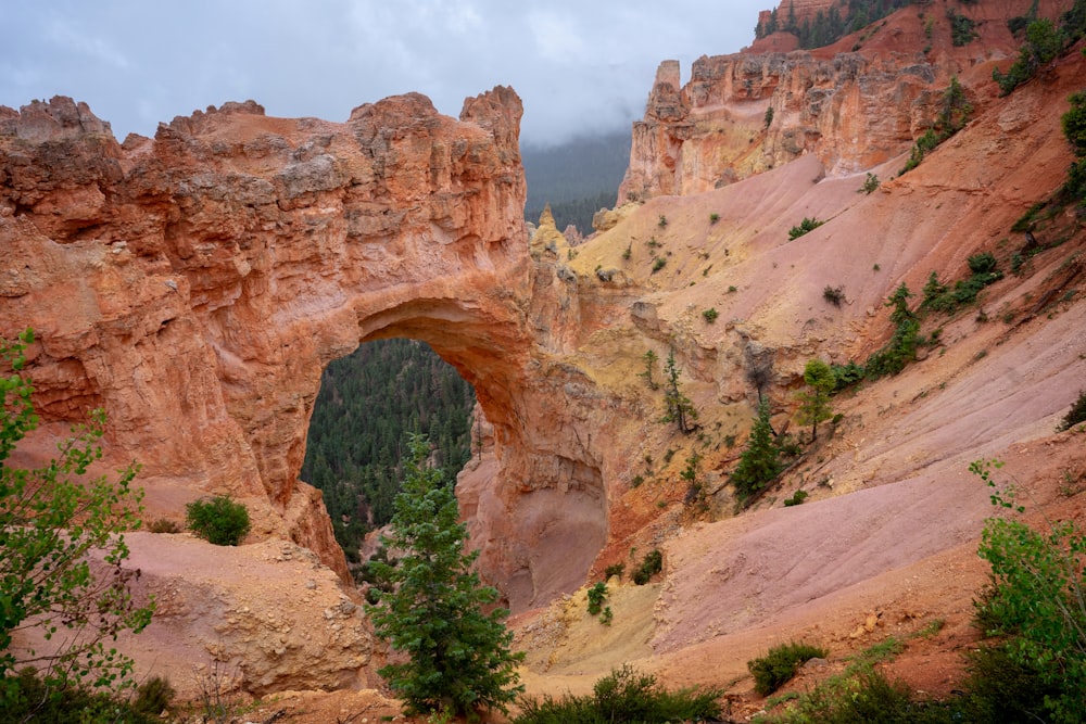 a large rock formation with a hole in the middle of it