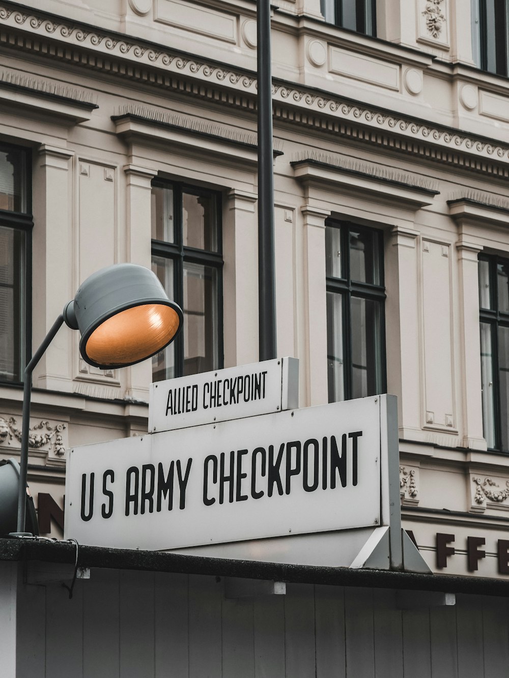 a us army checkpoint sign on the side of a building
