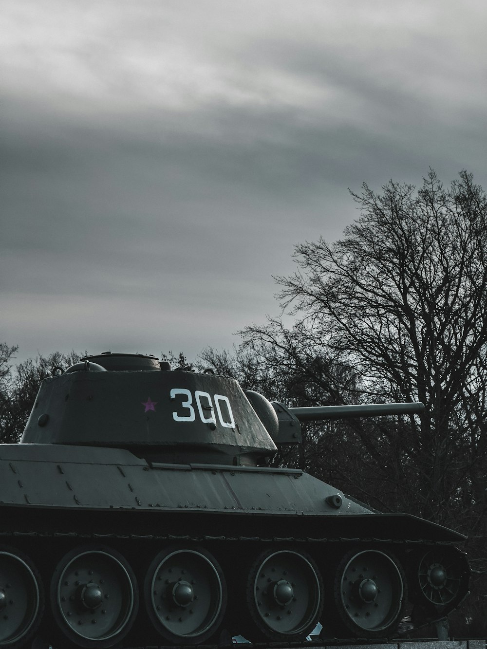 a tank sitting in the middle of a field