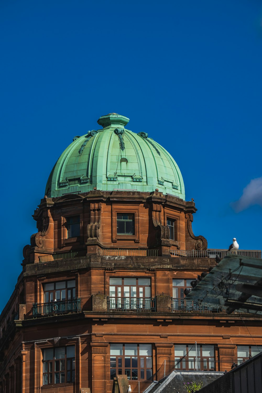 a large building with a green dome on top